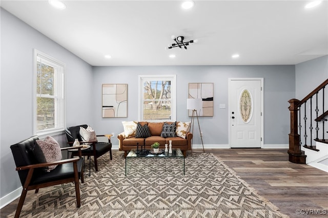 living room with stairway, a wealth of natural light, and recessed lighting