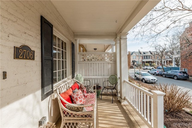 balcony with a residential view and a porch