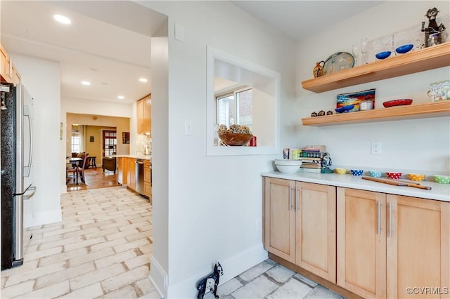 bar with baseboards, appliances with stainless steel finishes, brick floor, and recessed lighting