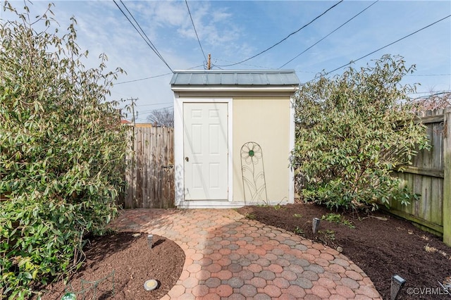 view of shed with a fenced backyard