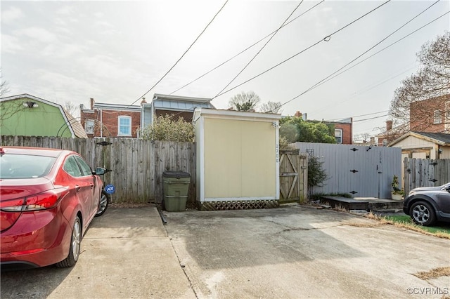 garage featuring a gate and fence