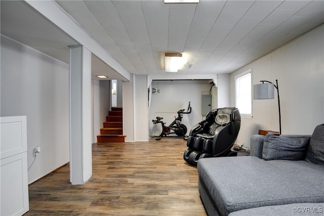 interior space featuring electric panel and wood finished floors