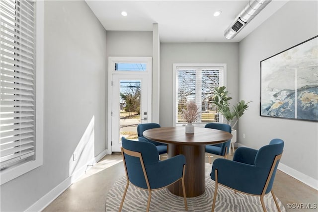 dining area with recessed lighting and baseboards