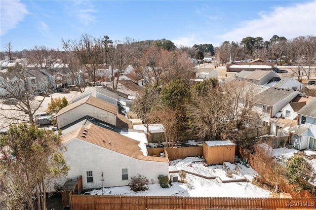 snowy aerial view with a residential view