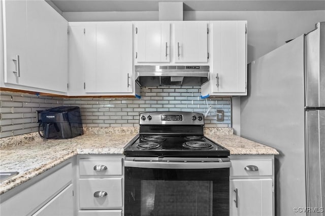 kitchen with tasteful backsplash, light countertops, white cabinetry, black range with electric cooktop, and under cabinet range hood