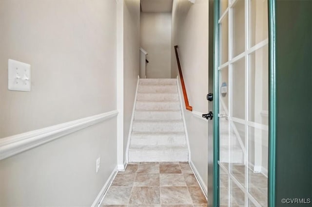 staircase with baseboards