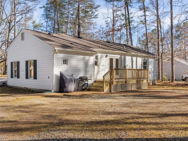 back of property featuring french doors and a wooden deck