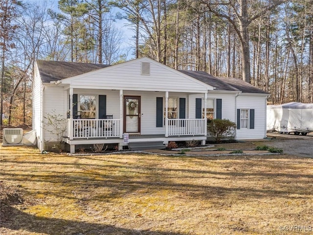 view of front of house with a porch and a front yard