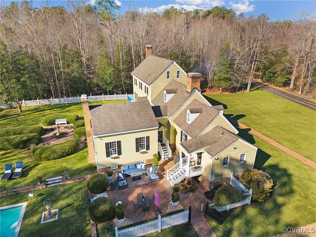 aerial view featuring a wooded view