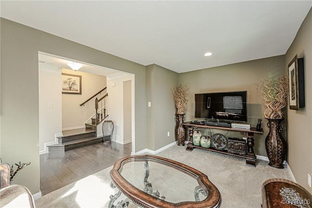 living area with recessed lighting, stairway, and baseboards