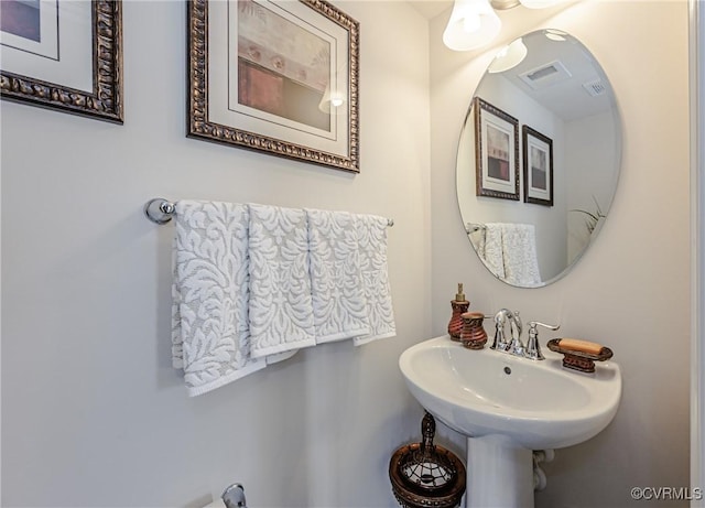 bathroom with visible vents and a sink