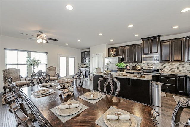 dining area with a ceiling fan, dark wood-style flooring, and recessed lighting