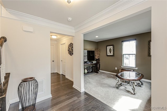 interior space featuring baseboards, dark wood-style flooring, and crown molding