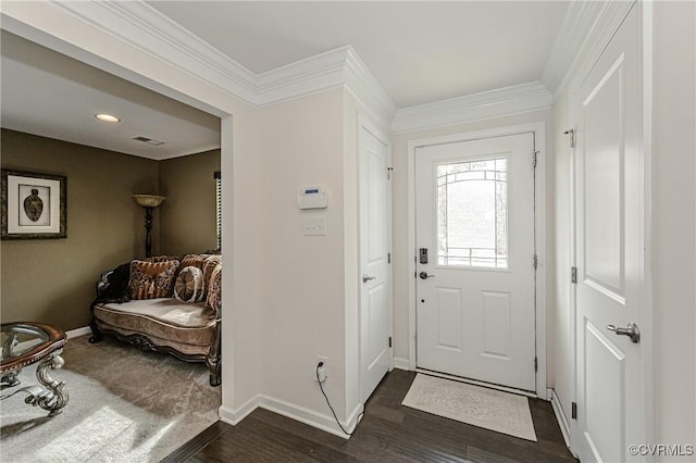 foyer with baseboards, dark wood-style floors, visible vents, and crown molding