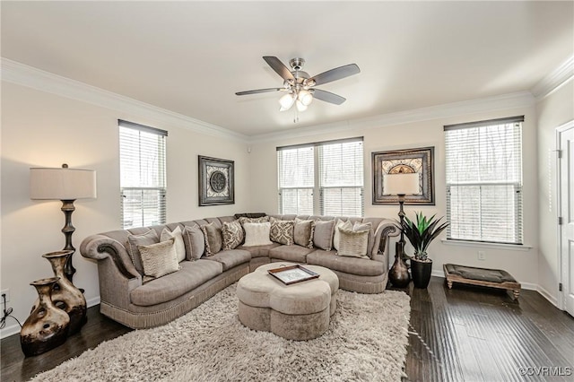 living room with a healthy amount of sunlight, dark wood-style floors, and ornamental molding