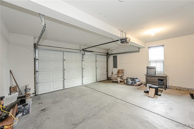 garage featuring electric panel and a garage door opener