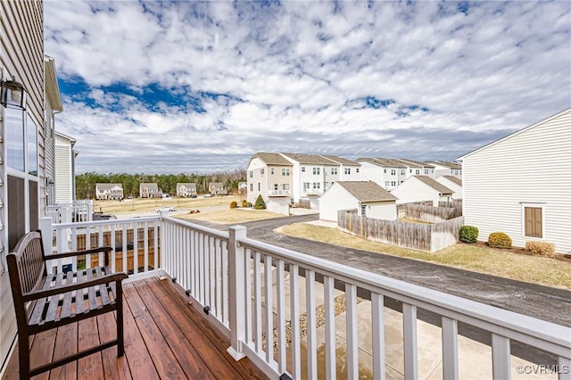 wooden terrace with a residential view