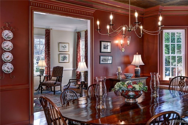 dining space featuring an inviting chandelier and crown molding