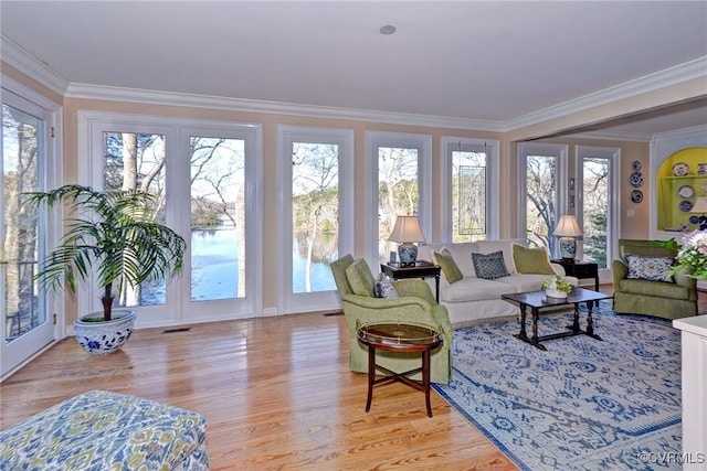 sunroom featuring a healthy amount of sunlight and visible vents