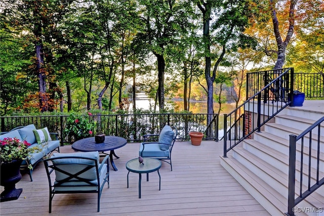 wooden deck featuring stairway and outdoor lounge area