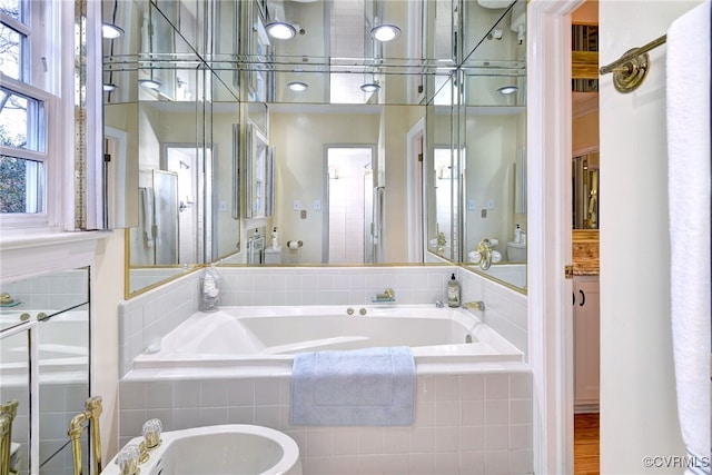 bathroom featuring a bidet and a garden tub