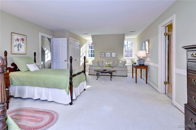 carpeted bedroom featuring baseboards