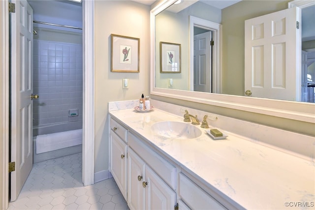 full bathroom with tile patterned flooring and vanity