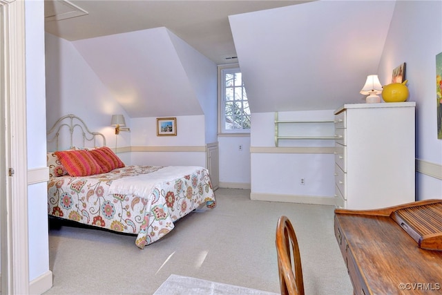 bedroom featuring carpet and vaulted ceiling