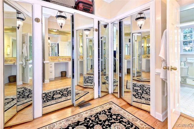 interior space featuring wood finished floors and visible vents