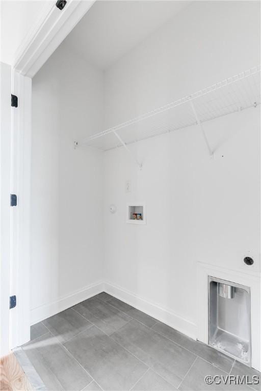 laundry room featuring laundry area, baseboards, hookup for a gas dryer, and washer hookup