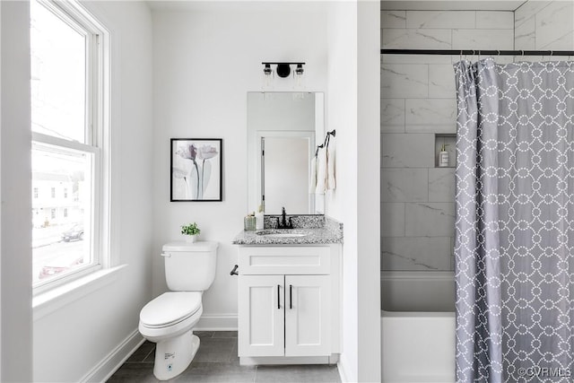 bathroom with shower / bathtub combination with curtain, toilet, vanity, and baseboards