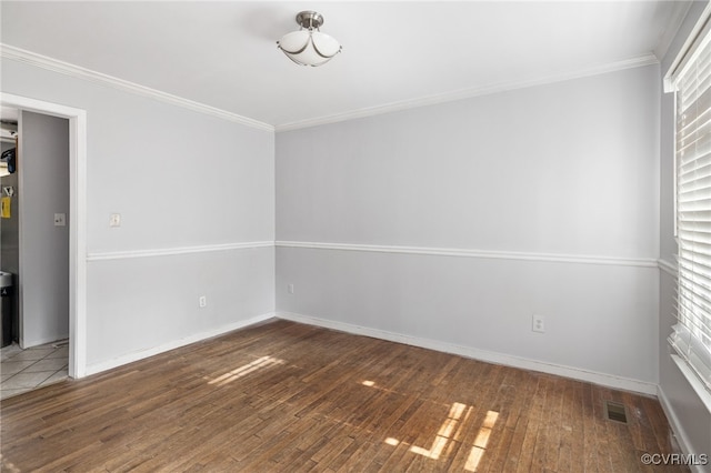 unfurnished room with dark wood-type flooring and ornamental molding