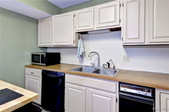 kitchen with light countertops, white cabinetry, and dishwasher