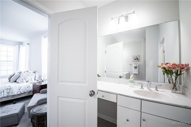 bathroom featuring ensuite bathroom and vanity