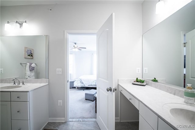 ensuite bathroom featuring two vanities, a sink, and ensuite bathroom