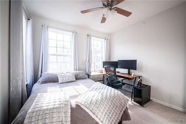 bedroom with carpet flooring, a ceiling fan, and baseboards