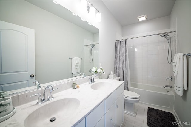 bathroom featuring shower / bath combo, a sink, toilet, and tile patterned floors