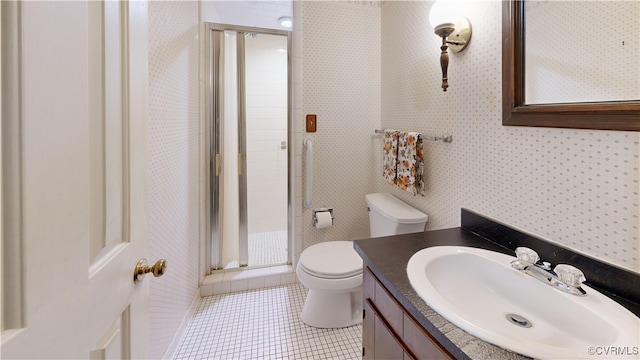 bathroom with tile patterned floors, toilet, a stall shower, vanity, and wallpapered walls