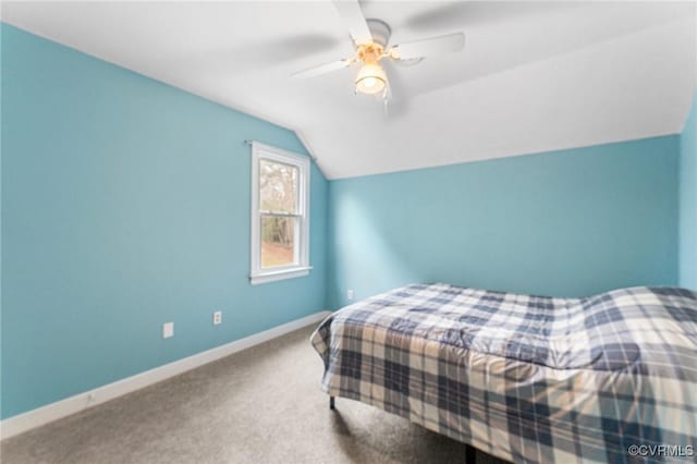 bedroom featuring baseboards, a ceiling fan, carpet flooring, and vaulted ceiling