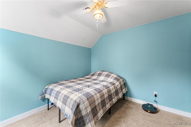 carpeted bedroom with baseboards, lofted ceiling, and ceiling fan