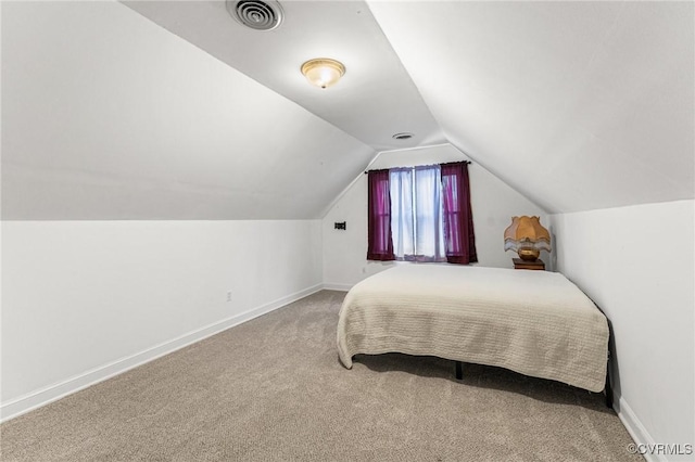 carpeted bedroom with visible vents, baseboards, and lofted ceiling