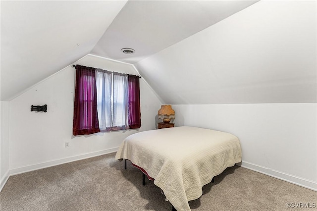 bedroom with visible vents, carpet flooring, lofted ceiling, and baseboards