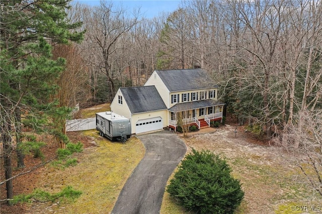 drone / aerial view featuring a view of trees