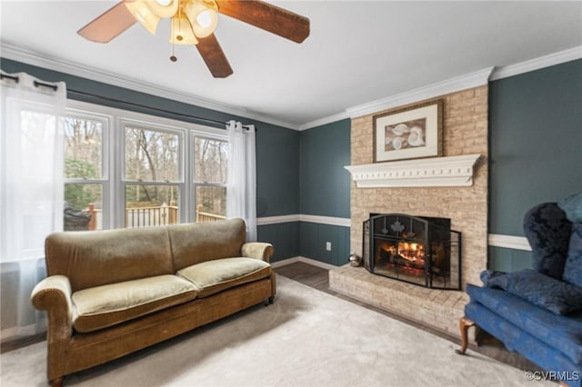 living room featuring a brick fireplace, crown molding, and baseboards