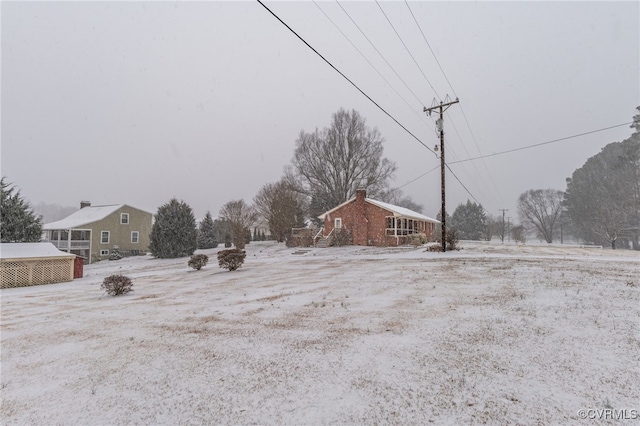 view of yard covered in snow