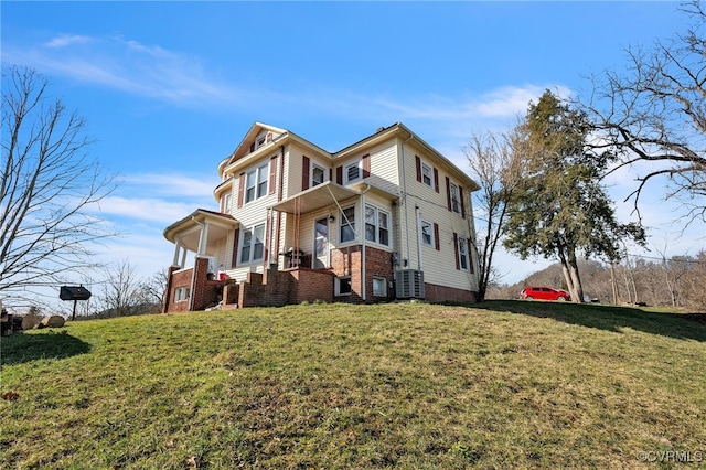 view of front of property with a front yard and brick siding