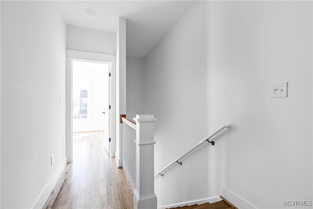 interior space featuring baseboards and wood finished floors