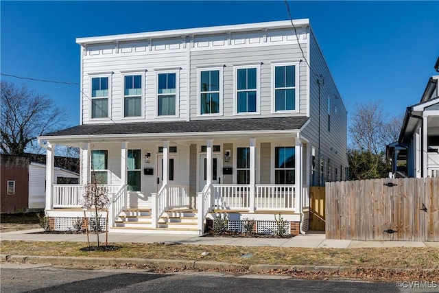 view of front of property featuring a porch and fence