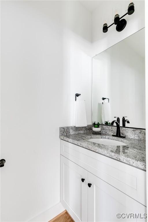 bathroom featuring vanity and baseboards