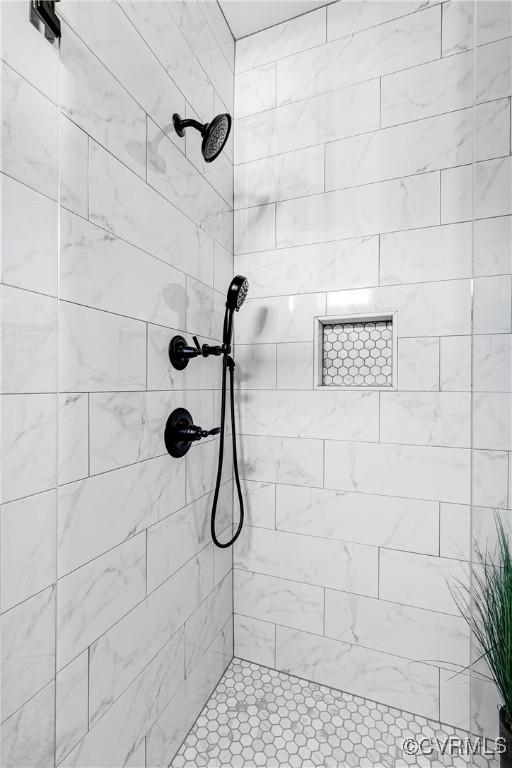 full bathroom with a tile shower